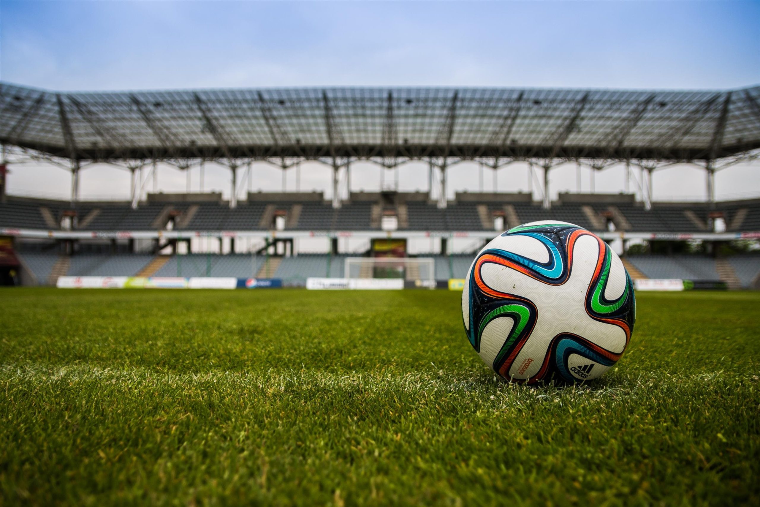 Football on grass field during day time